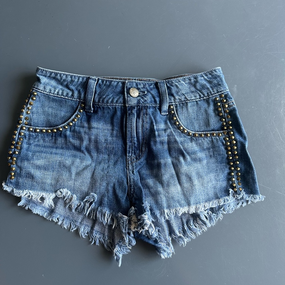 GUESS, gold studded jean short shorts.